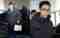 Miles de personas reciben a TOP de BIGBANG tras su regreso del servicio militar